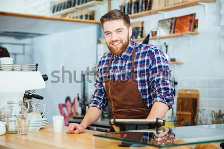 Feliz bonito barista camisas marrom Foto stock © deandrobot