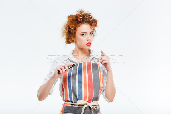 Young housewife holding sharp knife Stock photo © deandrobot