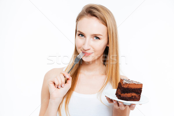 Vonzó mosolyog fiatal nő eszik darab csokoládés sütemény Stock fotó © deandrobot