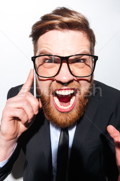 Vertical imagen hombre de negocios gritando teléfono gafas Foto stock © deandrobot