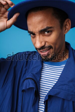Stock photo: Portrait of angry african man over white background