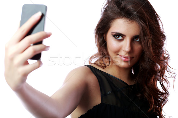Happy woman taking self picture with smartphone camera Stock photo © deandrobot