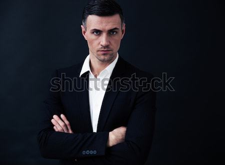 [[stock_photo]]: Portrait · affaires · bras · pliées · noir · regarder