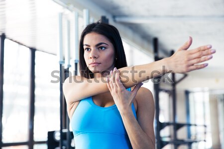 Stock photo: Beautiful fitness woman with arms folded