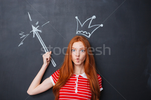 Funny woman with crown and magic wand drawn on chalkboard  Stock photo © deandrobot
