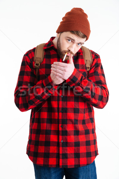 Férfi hipszter dohányzás cigaretta izolált fehér Stock fotó © deandrobot
