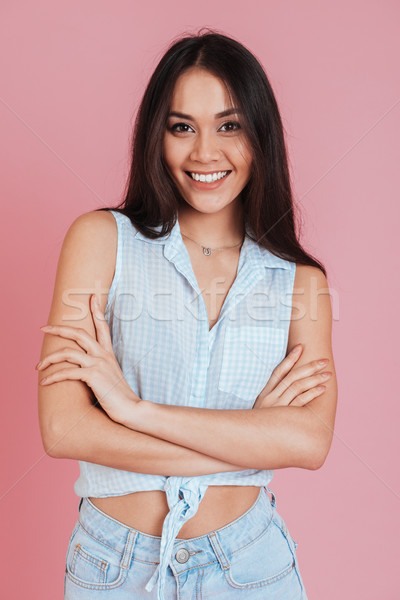 Boldog fiatal nő áll nyugodt kezek összehajtva Stock fotó © deandrobot