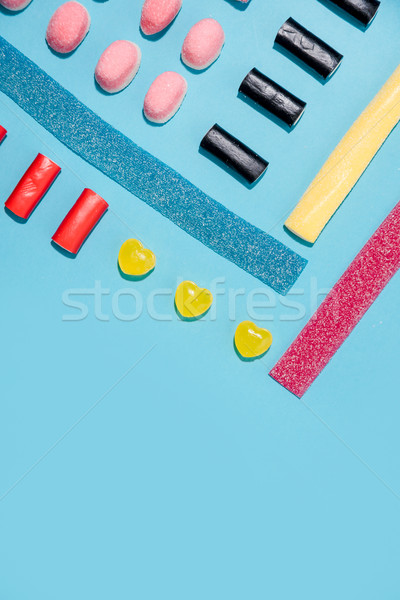 Top view of a sweet sugar candies in a row Stock photo © deandrobot