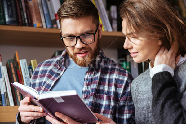 Homme femme examens bibliothèque ensemble heureux [[stock_photo]] © deandrobot