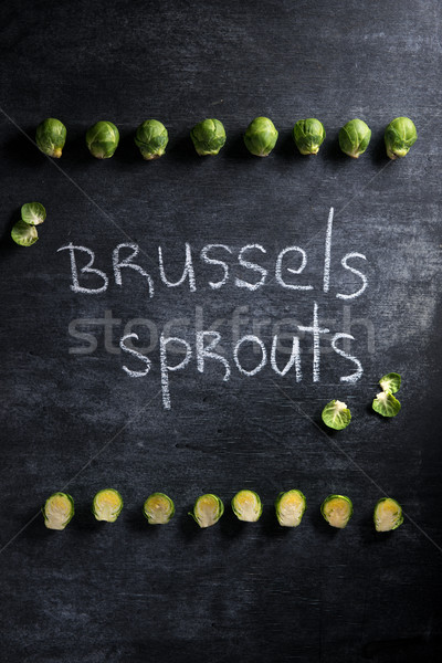 Brussels sprouts over dark background. Stock photo © deandrobot