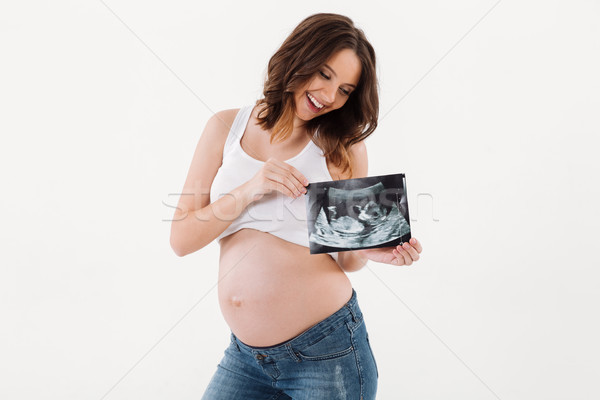 Feliz mujer embarazada ultrasonido escanear bebé Foto stock © deandrobot