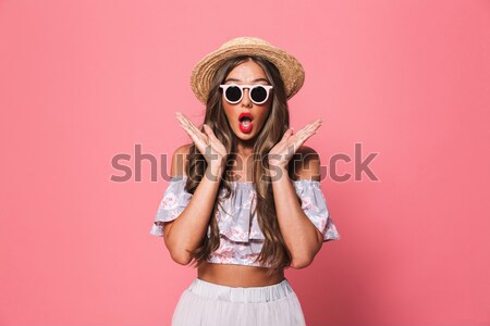 Excitado dama gafas de sol pie aislado Foto stock © deandrobot