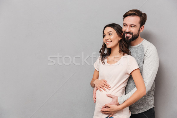 肖像 笑みを浮かべて 若い男 妊娠 妻 ストックフォト © deandrobot