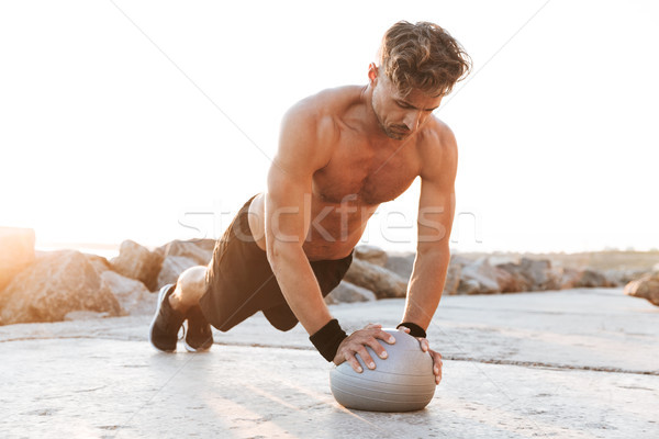 Portrait of a healthy shirtless sportsman Stock photo © deandrobot