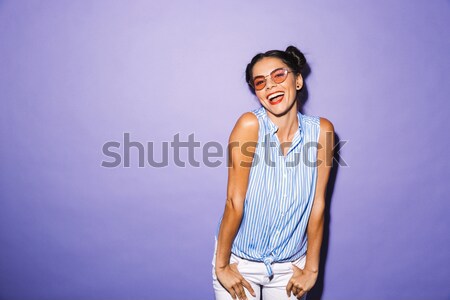 Portrait of a pretty girl in sweatshirt posing Stock photo © deandrobot