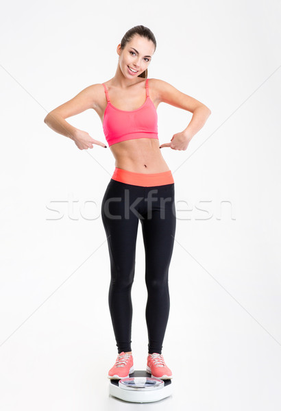 Zdjęcia stock: Atrakcyjny · zawartość · fitness · dziewczyna · wskazując