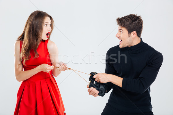 Man theif stealing young woman bag Stock photo © deandrobot