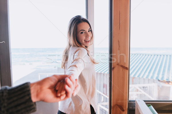 Woman pulling her man Stock photo © deandrobot