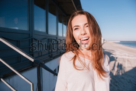 Woman in sweater covering from the sun Stock photo © deandrobot