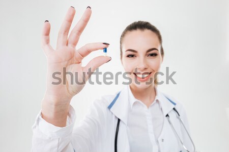Jovem feminino médico marcador mão Foto stock © deandrobot