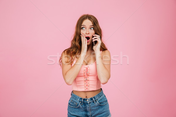 Portrait of an astonished pretty girl in summer clothes Stock photo © deandrobot