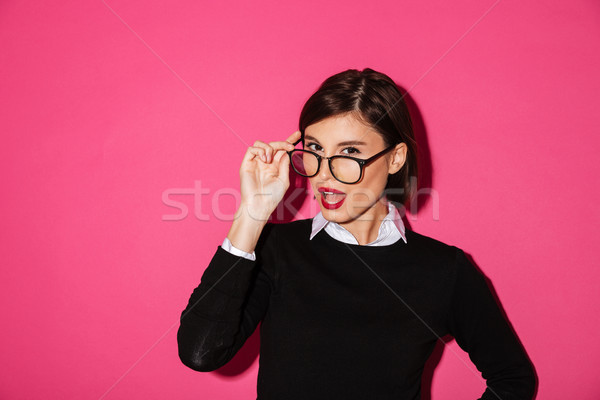 Stock photo: Surprised attractive lady in glasses looking camera