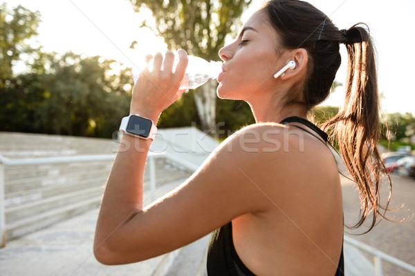 Közelkép portré fiatal fitnessz lány fülhallgató Stock fotó © deandrobot