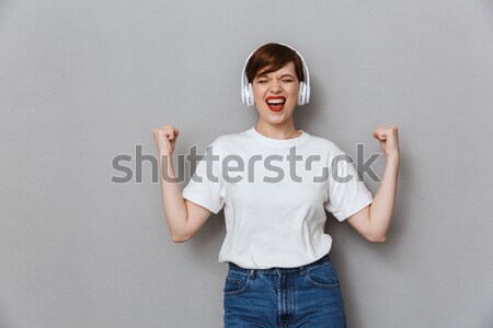 Portrait of an excited teenage boy in eyeglasses Stock photo © deandrobot