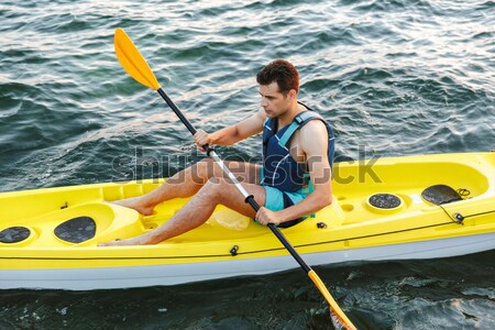 Kajakken man zee kajak water sport Stockfoto © deandrobot