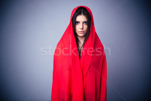 Portré bájos nő piros ruha szürke Stock fotó © deandrobot