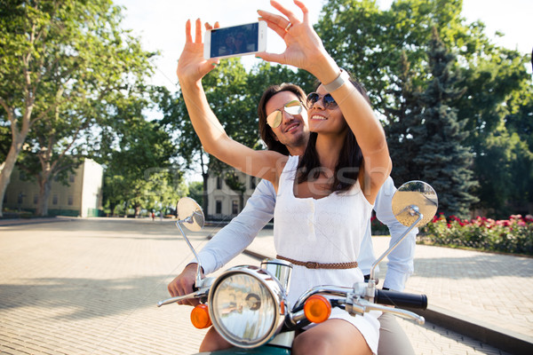 Happy couple making selfie photo on smartphone Stock photo © deandrobot