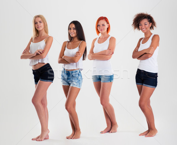 Portré boldog négy többnemzetiségű nők áll Stock fotó © deandrobot
