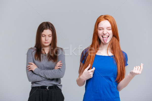 Two funny and depressed young women Stock photo © deandrobot
