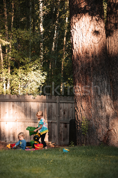 Full length image of boy and girl on playground Stock photo © deandrobot