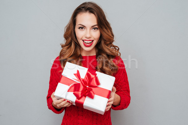 Boldog nő piros pulóver doboz tart Stock fotó © deandrobot