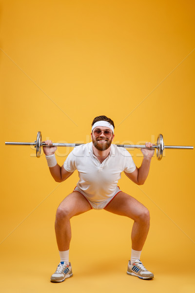 Feliz jovem esportes barbell Foto stock © deandrobot