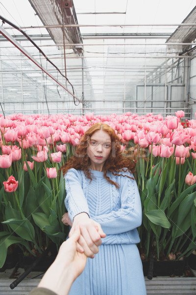 Girl falling on flowers Stock photo © deandrobot