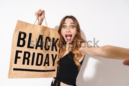 Stock photo: Naked woman in boxing gloves holding broadsheet