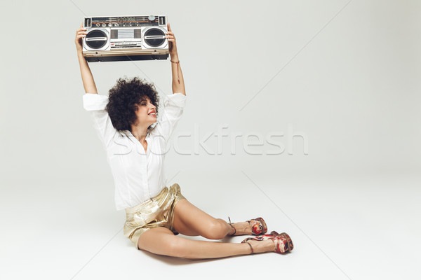 Happy retro woman with boombox. Stock photo © deandrobot