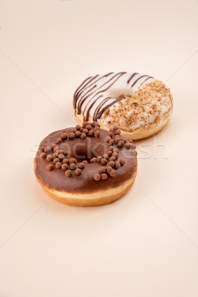 Side view of two donuts isolated over white Stock photo © deandrobot