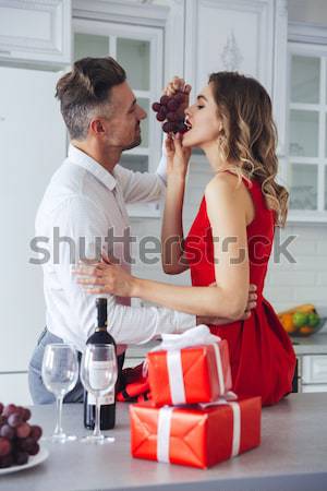 Portrait of a happy romantic smart dressed couple Stock photo © deandrobot