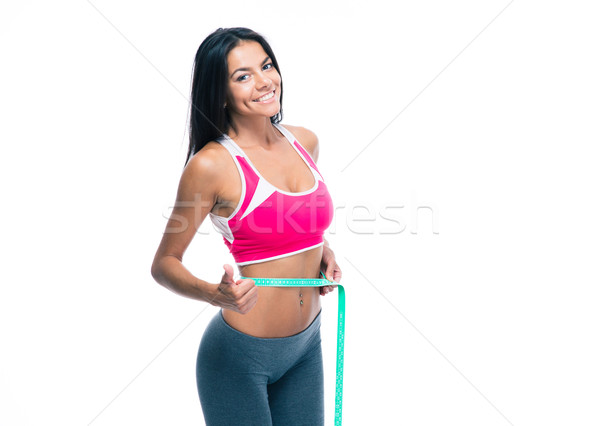 Stock photo: Smiling woman with measuring tape