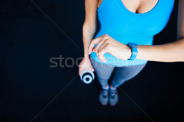 Woman with activity tracker Stock photo © deandrobot