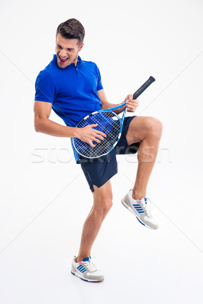Full length portrait of a male tennis player having fun Stock photo © deandrobot