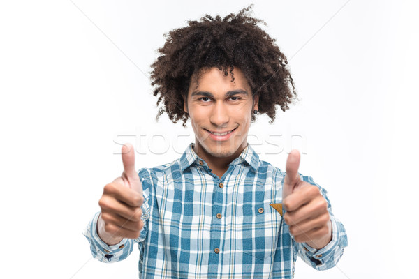 Glimlachend afro amerikaanse man krulhaar tonen Stockfoto © deandrobot