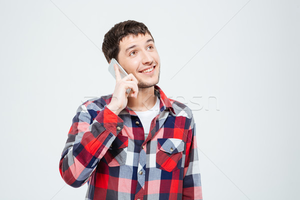 Sorridente casual homem falante telefone Foto stock © deandrobot