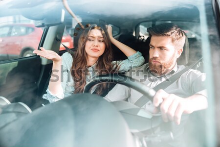 Couple sitting and talking in cabine of small aircraft Stock photo © deandrobot