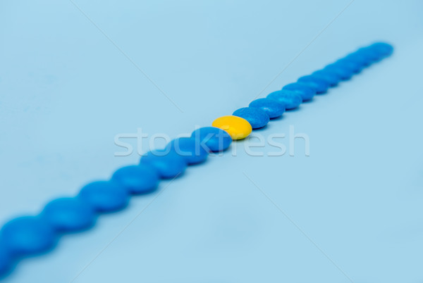 Colorful sweeties candy over blue table background. Stock photo © deandrobot