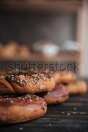Pastries on dark wooden table background Stock photo © deandrobot