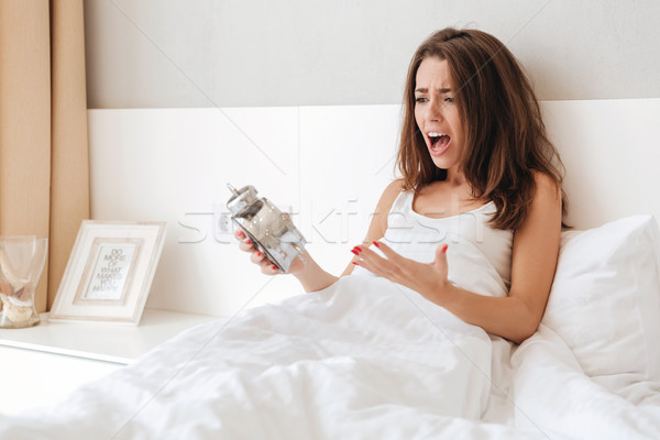 Upset young girl gesturing with hands and screaming Stock photo © deandrobot